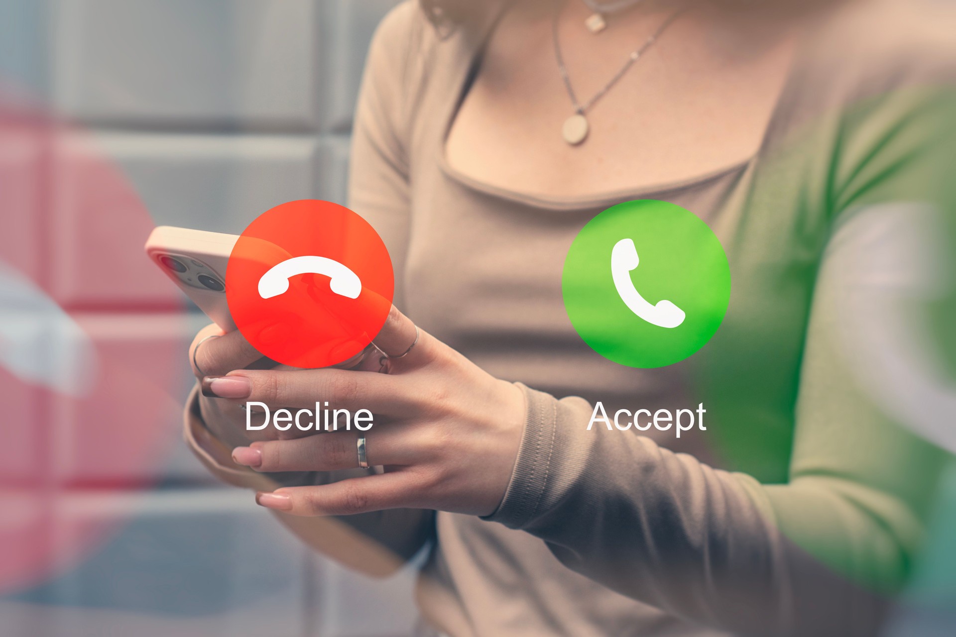 A woman chooses to accept or reject a call on a smartphone with red and green buttons.